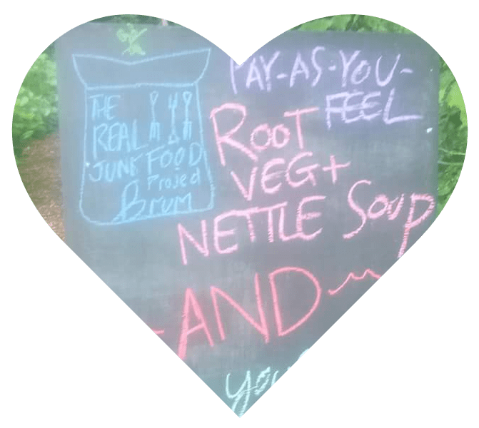 Heart showing a blackboard advertising Root Veg and Nettle Soup
